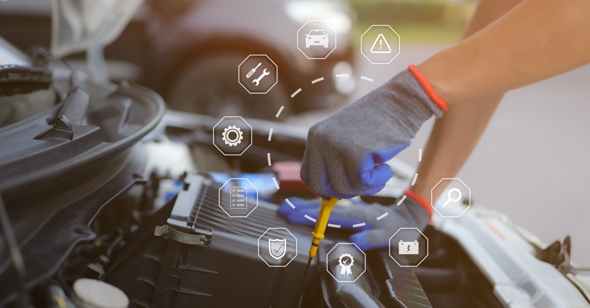 A close-up of a gloved hand checking the engine oil level under the hood, with car maintenance icons appearing.