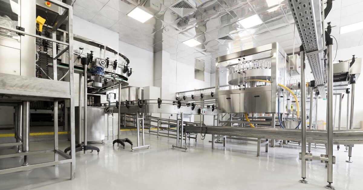 A food industrial factory for bottling alcoholic beverages. It's clean and full of brand-new machinery.